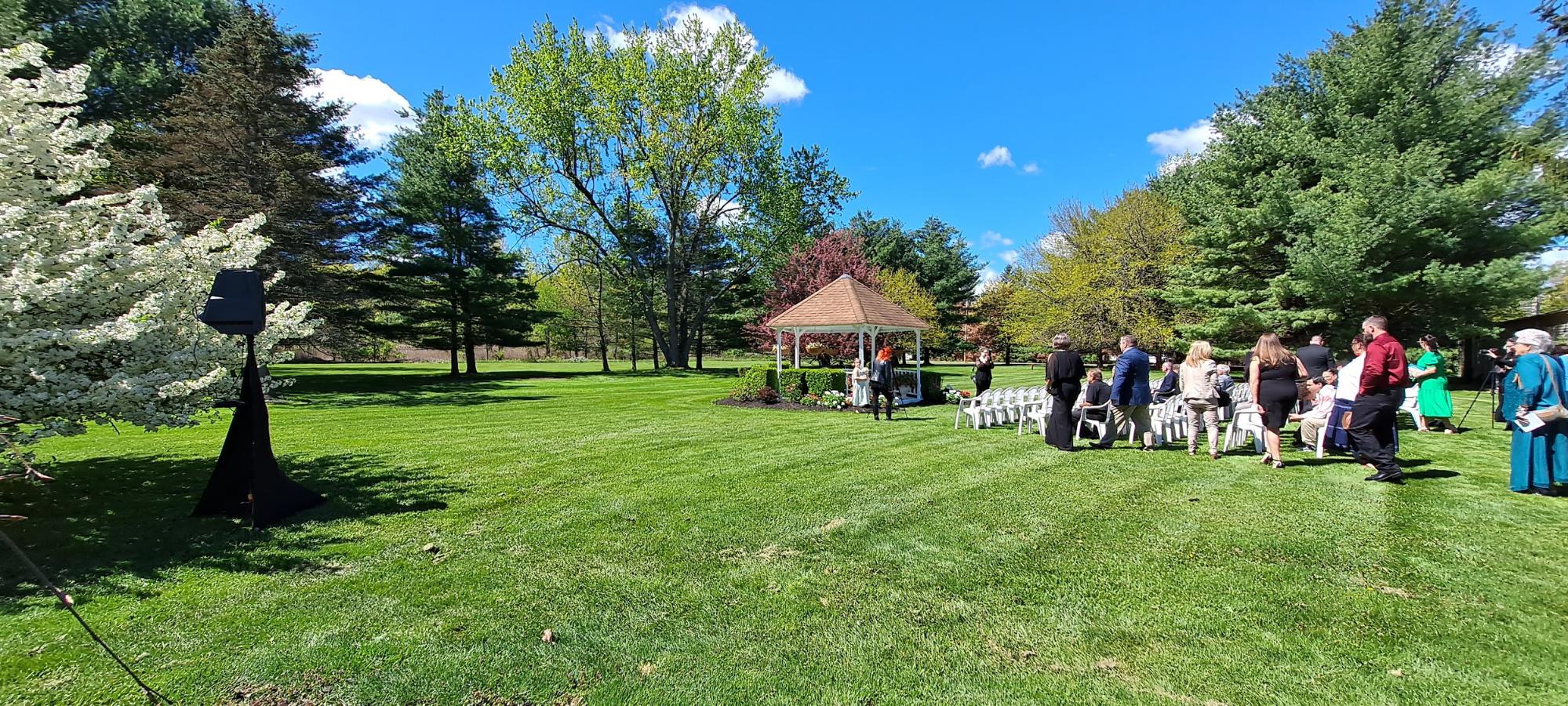 This is an example of my wedding ceremony setup. I apologize for the glare. I try to have a small footprint and you can see in the next picture I set up out of the way of your wedding photos. The is at "Colden Manor at Spruce Lodge" on a beautiful Saturday in May.